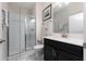 Bathroom features a walk-in shower and modern vanity at 8932 Stinger Dr, Davenport, FL 33896