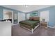 Spacious main bedroom with a king-size bed and large closet at 8932 Stinger Dr, Davenport, FL 33896