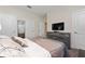 Well-lit bedroom with a queen-size bed and built-in dresser at 8932 Stinger Dr, Davenport, FL 33896