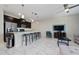 Open concept living room with kitchen and dining area at 8932 Stinger Dr, Davenport, FL 33896