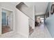 Open entryway with tile floors and views of stairs and living area at 8932 Stinger Dr, Davenport, FL 33896