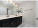 Modern bathroom with double vanity and marble-look tile at 8932 Stinger Dr, Davenport, FL 33896