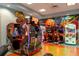 Fun filled game room featuring Jurassic Park and other arcade games at 8932 Stinger Dr, Davenport, FL 33896