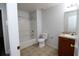 Bathroom with tub, toilet, and wood vanity at 1540 Nature Trl, Kissimmee, FL 34746