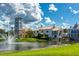 Resort-style community center with lake view and fountain at 1703 Encinitas Way, Kissimmee, FL 34759