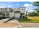 Two-story townhome with attached garage and front yard at 3550 Davenport Creek Ct, Kissimmee, FL 34746