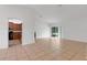 Spacious living area with tile floors and kitchen view at 3838 Gulf Shore Cir, Kissimmee, FL 34746
