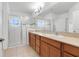 Bathroom with double vanity and walk-in shower at 3838 Gulf Shore Cir, Kissimmee, FL 34746