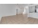 Open living room with tile floors and access to kitchen at 3838 Gulf Shore Cir, Kissimmee, FL 34746