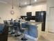 Modern kitchen with stainless steel appliances and breakfast bar at 4295 Paragraph Dr, Kissimmee, FL 34746