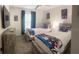 Bedroom with two twin beds, a large TV, and blue curtains at 4295 Paragraph Dr, Kissimmee, FL 34746