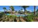 Resort-style lazy river with a bridge and lush landscaping at 4295 Paragraph Dr, Kissimmee, FL 34746