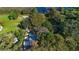 Aerial view showing home with pool, surrounded by lush trees at 4321 Rummell Rd, Saint Cloud, FL 34769