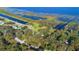 Aerial view showing home nestled in lush landscape near water at 4321 Rummell Rd, St Cloud, FL 34769