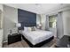 Comfortable main bedroom with a plush bed, stylish headboard, and ensuite bathroom at 4751 Clock Tower Dr # 107, Kissimmee, FL 34746