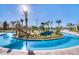 Community lazy river winding through a tropical landscape at 4751 Clock Tower Dr # 107, Kissimmee, FL 34746