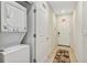 Stackable washer and dryer in convenient laundry room at 4751 Clock Tower Dr # 107, Kissimmee, FL 34746