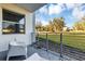 Private patio with chairs and view of the lawn at 4751 Clock Tower Dr # 107, Kissimmee, FL 34746