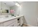 Elegant bathroom with double sinks and white cabinets at 4751 Clock Tower Dr # 107, Kissimmee, FL 34746