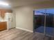 Kitchen features a sliding glass door to fenced patio, new flooring and appliances at 523 Royal Ridge Dr, Davenport, FL 33837