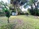 Large backyard with a shed and lush green grass at 5312 Goddard Ave, Orlando, FL 32810