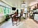 Bright kitchen and dining area combo with stainless steel appliances and an island at 5312 Goddard Ave, Orlando, FL 32810