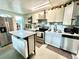 Updated kitchen with stainless steel appliances and island at 5312 Goddard Ave, Orlando, FL 32810