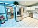 Modern kitchen with stainless steel refrigerator and white cabinets at 5312 Goddard Ave, Orlando, FL 32810