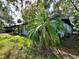 Side view of the house showing lush landscaping at 5312 Goddard Ave, Orlando, FL 32810