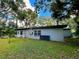 Rear view of light blue house with a neat lawn at 5312 Goddard Ave, Orlando, FL 32810