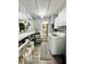 Laundry room with washer, dryer, and adjacent bathroom at 5312 Goddard Ave, Orlando, FL 32810