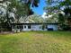 Ranch style home with a sunroom and neat lawn at 5312 Goddard Ave, Orlando, FL 32810