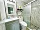 Modern bathroom with marble tile and updated vanity at 5312 Goddard Ave, Orlando, FL 32810