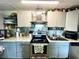 Updated kitchen with stainless steel appliances and island at 5312 Goddard Ave, Orlando, FL 32810
