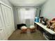 Small bedroom with double doors and two nightstands at 5312 Goddard Ave, Orlando, FL 32810