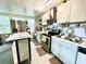 Updated kitchen with stainless steel appliances and island at 5312 Goddard Ave, Orlando, FL 32810