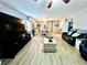 Spacious living room with hardwood floors, fireplace, and comfortable seating at 5312 Goddard Ave, Orlando, FL 32810