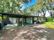 House with covered carport and a spacious front yard at 5312 Goddard Ave, Orlando, FL 32810