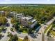 Aerial view of building and surrounding landscape, showcasing convenient location at 7662 Whisper Way # 402, Reunion, FL 34747