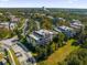 Drone view of community, showcasing building location and surrounding landscape at 7662 Whisper Way # 402, Reunion, FL 34747