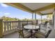Relaxing balcony with outdoor furniture and scenic views at 7662 Whisper Way # 402, Reunion, FL 34747
