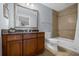 Clean bathroom with granite countertops and a tub/shower combo at 7662 Whisper Way # 402, Reunion, FL 34747