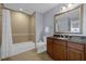 Well-appointed bathroom with granite vanity and shower at 7662 Whisper Way # 402, Reunion, FL 34747
