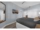 Bright bedroom with a large TV and plenty of closet space at 7662 Whisper Way # 402, Reunion, FL 34747