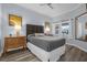 Comfortable bedroom with wood floors and neutral color scheme at 7662 Whisper Way # 402, Reunion, FL 34747