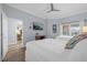 Spacious bedroom with two twin beds, a view of the balcony and plenty of light at 7662 Whisper Way # 402, Reunion, FL 34747