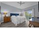 Spacious bedroom with king-size bed, private balcony, and en-suite bathroom at 7662 Whisper Way # 402, Reunion, FL 34747
