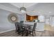 Dining area with wood table and chairs, adjacent to kitchen at 7662 Whisper Way # 402, Reunion, FL 34747