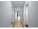 Bright hallway with tile flooring and access to rooms at 7662 Whisper Way # 402, Reunion, FL 34747