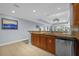 Kitchen with granite countertops, stainless steel appliances, and island at 7662 Whisper Way # 402, Reunion, FL 34747